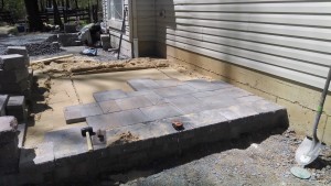 backyard patio partially constructed with foundation still visible