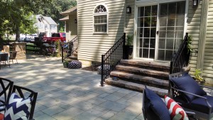 closeup of patio paver detail and stone steps leading to back door