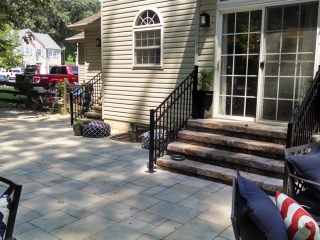 closeup of patio paver detail and stone steps leading to back door