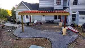 outdoor living space being constructed in backyard patio
