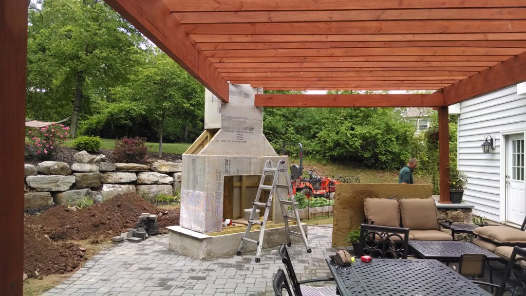 frame of outdoor fireplace attached to outdoor roof